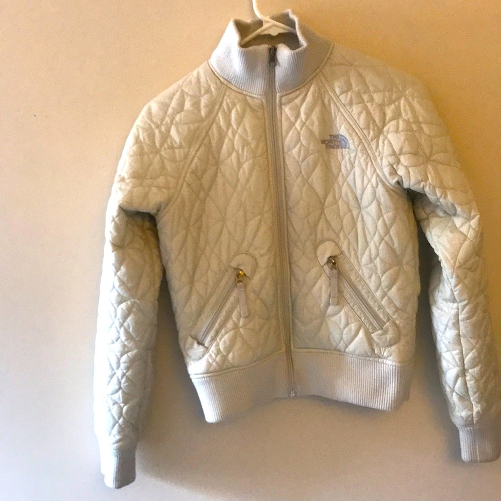 Beige “The North face” shell jacket.